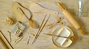 kitchen utensils from eco friendly materials on tablecloth made of compressed tree bark, recycling, environmental conservation