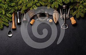 Kitchen utensils and fir tree branches on cooking table. Christmas cooking concept