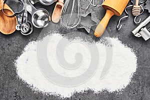 Kitchen utensils and flour for baking or cooking background