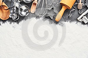 Kitchen utensils and flour for baking or cooking background