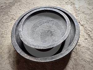 Kitchen utensils in the form of black cobek made of natural stone