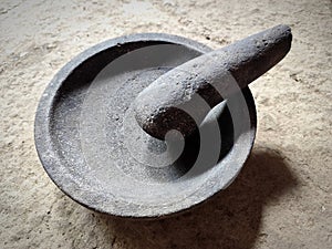 Kitchen utensils in the form of black cobek made of natural stone
