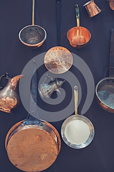 Kitchen utensils hanged on black wall