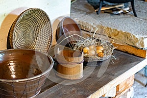 Kitchen utensils in the interior of old traditional rural wooden house.