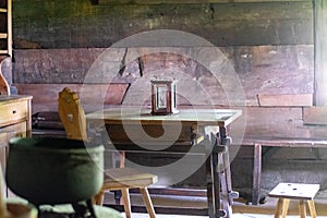 Kitchen utensils in the interior of old traditional rural wooden house.