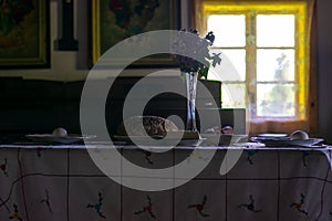 Kitchen utensils in the interior of old traditional rural wooden house.