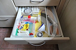 Kitchen utensils in an open drawer