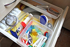 Kitchen utensils in an open drawer