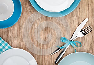 Kitchen utensils over wooden table