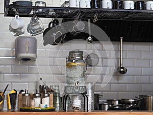 Kitchen utensils on the wall in the kitchen.