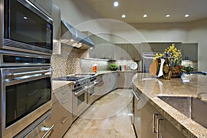 Kitchen With Vent Hood Above Stainless Steel Stove