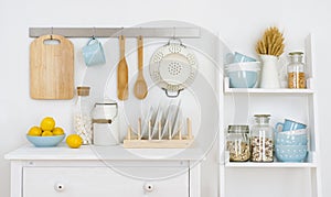 Kitchen wall decorated interior with cabinet and shelf with utensils