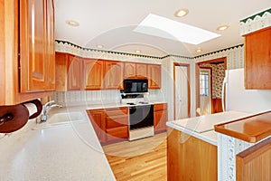 Kitchen with water view and white countertop.