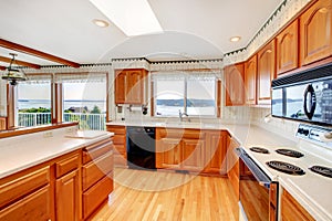 Kitchen with water view and white countertop. photo