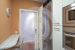 Kitchen with white cabinets and stainless steel appliance