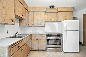 Kitchen with a white refrigerator and a stove
