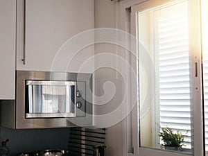 Kitchen Window View with Nearby Microwave