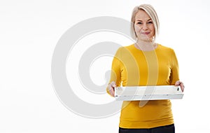 Kitchen woman gives empty tray for your advertising products isolated on white background. Mock up for use