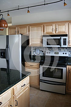 Kitchen wood cabinets stainless refrigerator