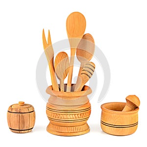 Kitchen wooden utensils (spoon, fork, pestle, mortar) isolated on white