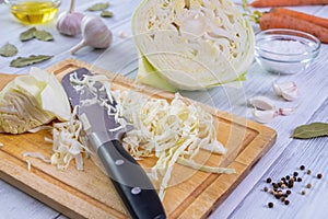 Kitchen workspace with the process of shredding white cabbage