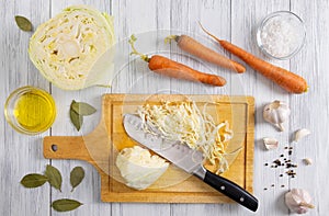 Kitchen workspace with white cabbage shredding process