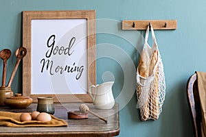 Kitchen worktop with mock up poster frame.