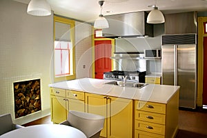 Kitchen yellow wood cabinets stainless stove