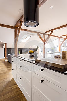 Kitchenette with white cabinets