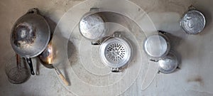 Kitchenware hang on cement wall