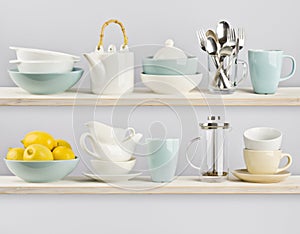 Kitchenware on wooden kitchen shelves