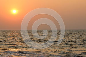 a kite boarder is enjoying some fun in the sunset