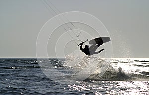 Kite boarder jumping on the ocean