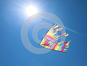 kite with bright colors that flies high in the sky symbol of fre