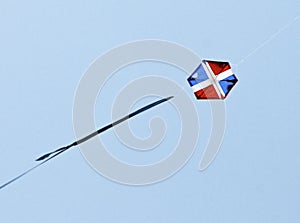 Kite in flight with Flag