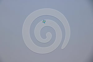 kite flying in blue sky on kite flying day