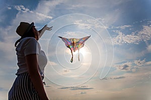 Kite in hand against the blue sky in summer, flying kite launching, fun summer vacation, freedom