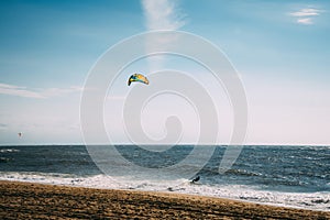 Kite surf in the ocean. A man doing kite surf. Paradise nature.