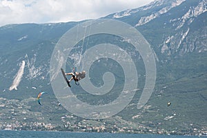 Kite surfer in the air at lake garda, italy