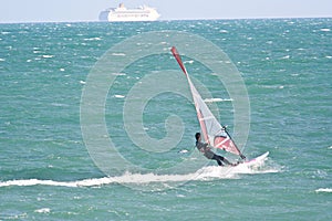 Wind surfer and car ferry