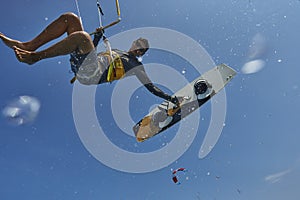 Kite surfer jumps with kiteboard