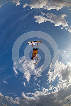 Kite surfer jumps with kiteboard