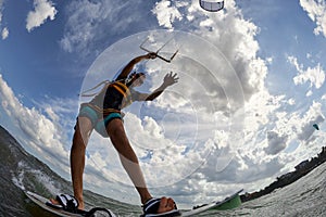 Kite surfer jumps with kiteboard photo