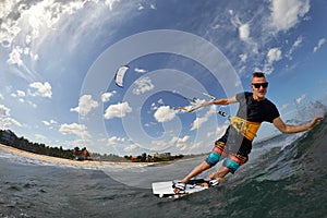 Kite surfer jumps with kiteboard photo