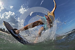 Kite surfer jumps with kiteboard photo