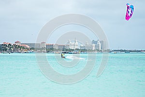 Kite surfer on Palm Beach at Aruba island in the Caribbean