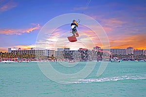 Kite surfer at Palm Beach on Aruba at sunset