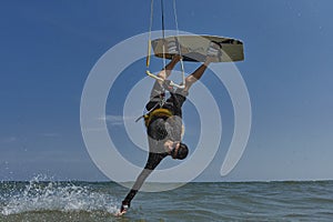 Kite surfer rjumps with kiteboard