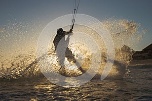 Kite surfer at sunset