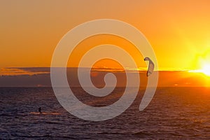 Kite surfer on sunset
